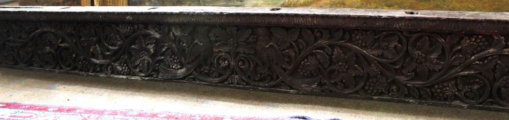 Antique carved painted oak frieze elaborately decorated with exotic birds and foliage, 216cm long