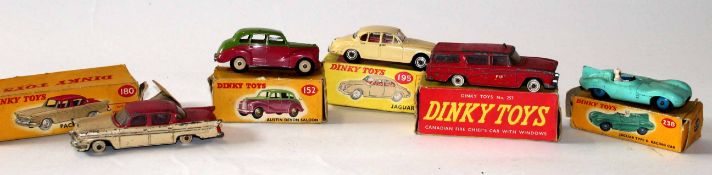 Collection of five Dinky toys comprising Packard Clipper No 180, Austin Devon saloon No 152,