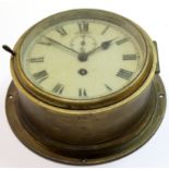 Ship's clock in brass case with circular dial and second hand, 18cm diam