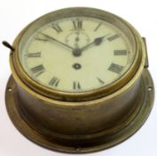 Ship's clock in brass case with circular dial and second hand, 18cm diam