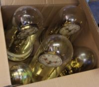 Group of five anniversary clocks with painted dials, all with glass domes