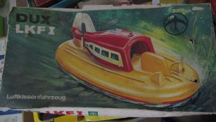 Boxed 1960s Dux LKF1 Luftkissenfaharzeug German remote control hovercraft toy, length approx 34cm,