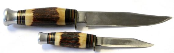 Two bone handled hunting daggers in leather sheath