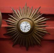 Mid-20th century gilt cased "Sunburst" wall timepiece, the gilt finished sunburst case with raised