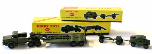 Two Dinky military vehicles comprising a 25 pounder field gun set No 697 and a tank transporter No