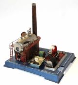 Model of a steam engine, by Wilesco on metal base