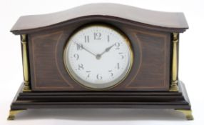 Edwardian mantel clock with brass pillars, white enamel dial and French movement, the clock raised