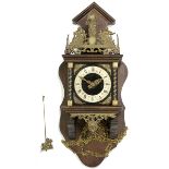 Wall clock with silvered dial and carved metal figures above