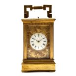 Early 20th century Continental gilt brass carriage clock, the enamelled dial surrounded by a gilt