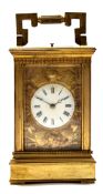 Early 20th century Continental gilt brass carriage clock, the enamelled dial surrounded by a gilt