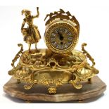 French style 19th century gilt brass clock on rococo base with lady by the side of the clock