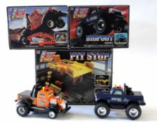 Group of three pit stop supersize truck models