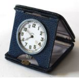 Swiss made 8-day travelling clock in leather case