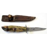 Cased Commando type knife in leather sheath, blade length approx 15cm