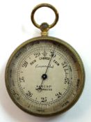 Gilt brass circular barometer, by A & NCS Ltd, Westminster, 4cm diam