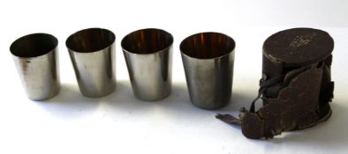 Cased set of metal field drinking beakers