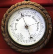 Circular barometer by a Lowestoft maker in wooden frame, 23cm diam