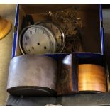 Box containing various clock parts and dials