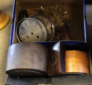 Box containing various clock parts and dials