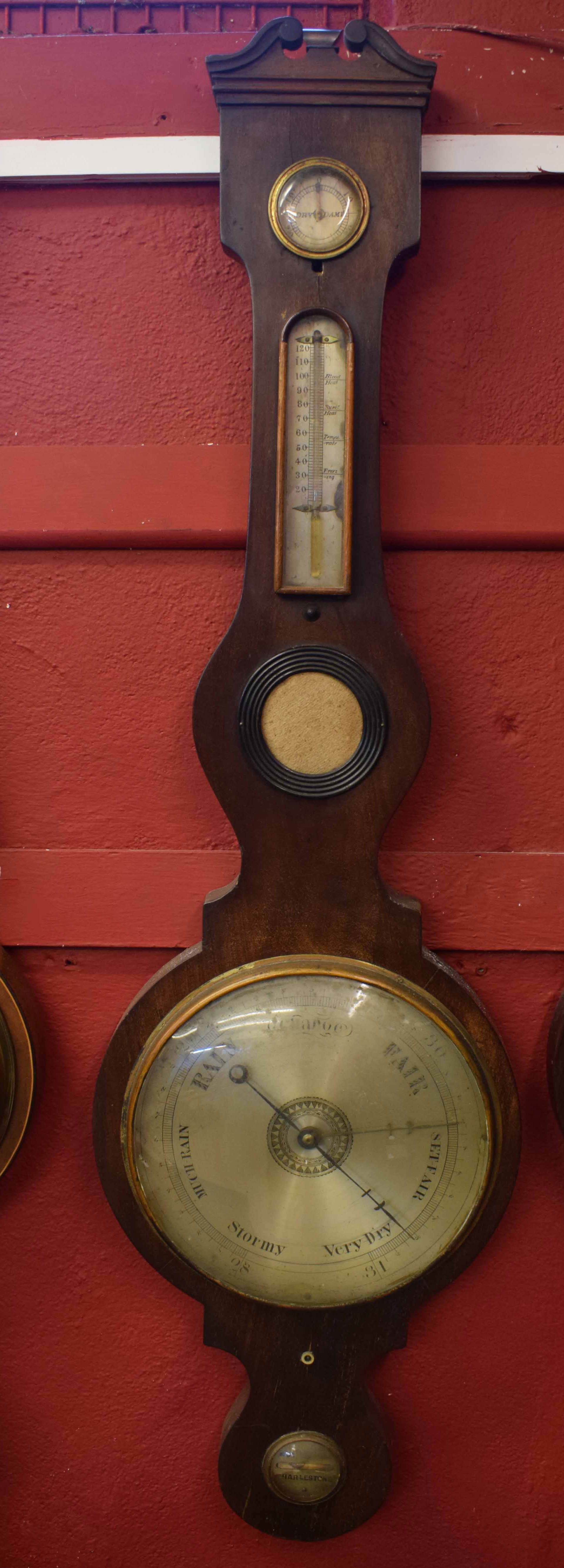 Mid-19th century mahogany cased wheel barometer with swan necked pediment over a silvered hygrometer