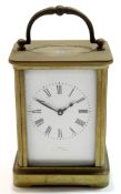 Early 20th century English brass carriage clock, the white enamel dial indistinctly marked with a