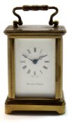 Miniature brass carriage clock, the white enamel dial by Matthew Norman with Swiss movement, 6cm