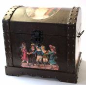 Wooden casket containing quantity of dolls clothing