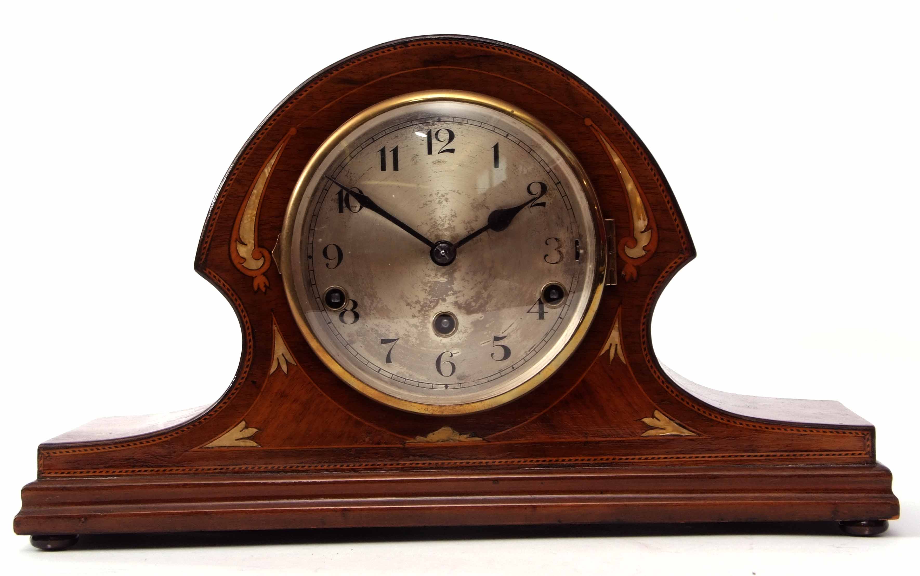 Mid-20th century mahogany and boxwood line inlaid triple barrel mantel clock, the arched and waisted