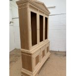 Three door Bookcase, with pediment, from the Trafalgar Cherry range, requires finishing/polishing.