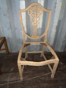 Decoratively carved shield-back Chair (requires finishing/polishing)