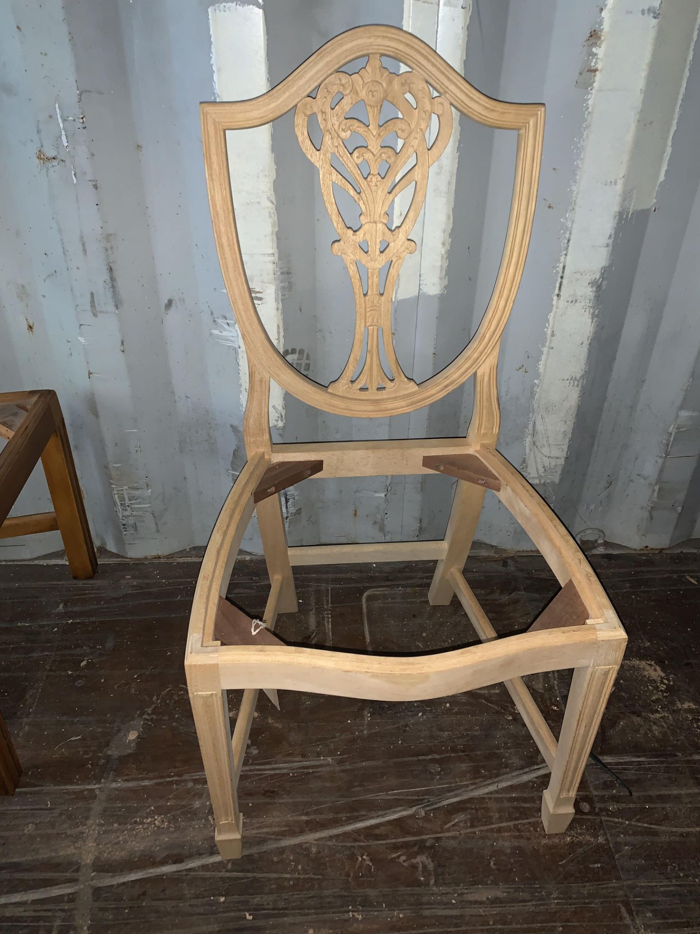 Decoratively carved shield-back Chair (requires finishing/polishing)