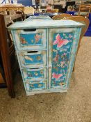 PAINTED CUPBOARD WITH FOUR DRAWERS AND CUPBOARD DOORS WITH FAIRY AND BUTTERFLY DETAIL