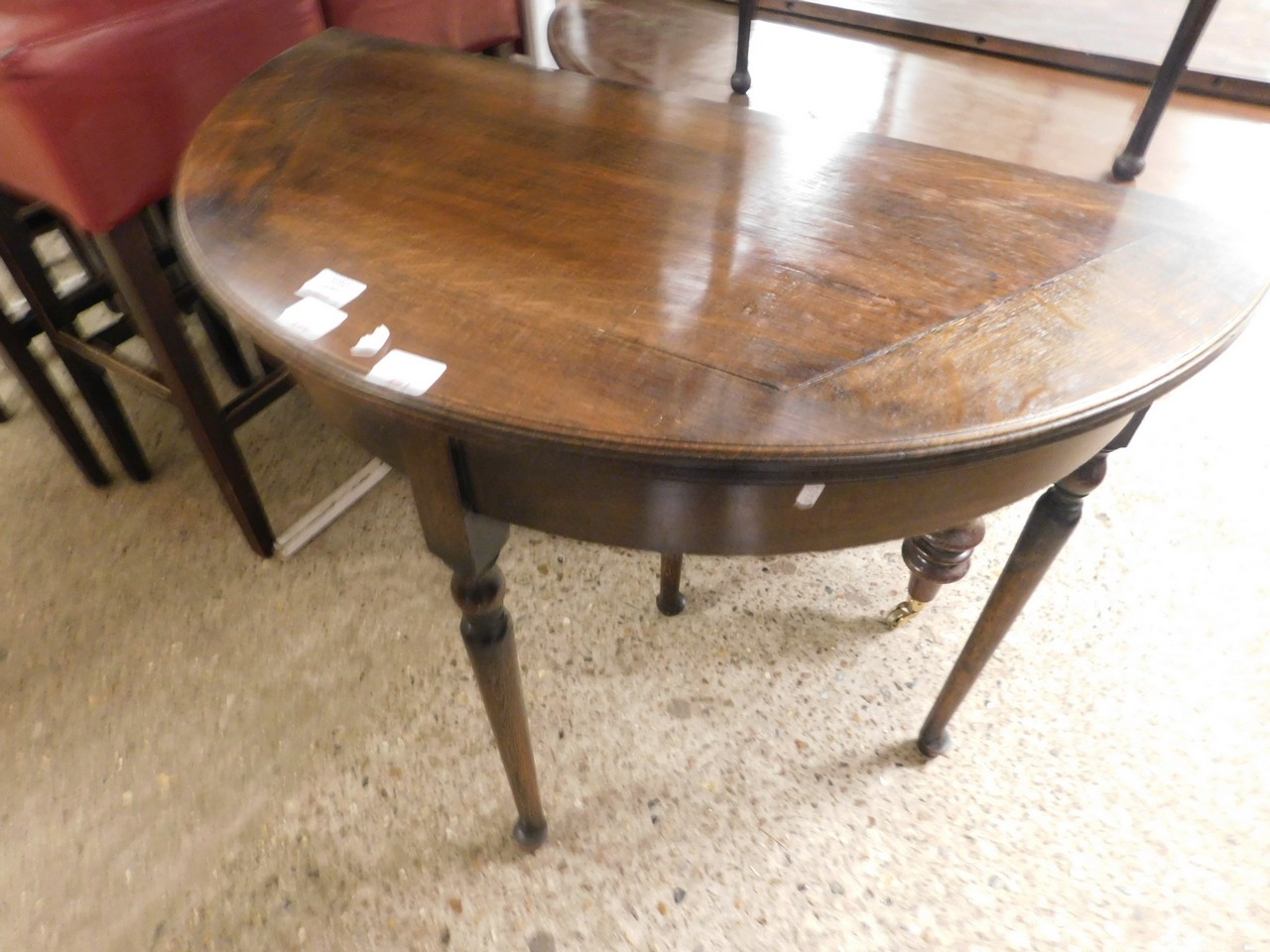 OAK FRAMED DEMI-LUNE FOLD OVER CARD TABLE WITH GREEN BAIZE LINED INTERIOR ON FOUR TURNED LEGS