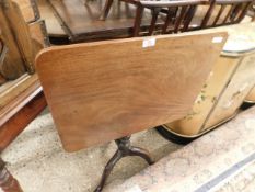 19TH CENTURY MAHOGANY RECTANGULAR TILT TOP TABLE ON A TURNED COLUMN AND A TRIPOD BASE