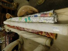 FOUR ROLLS OF ASSORTED FABRIC