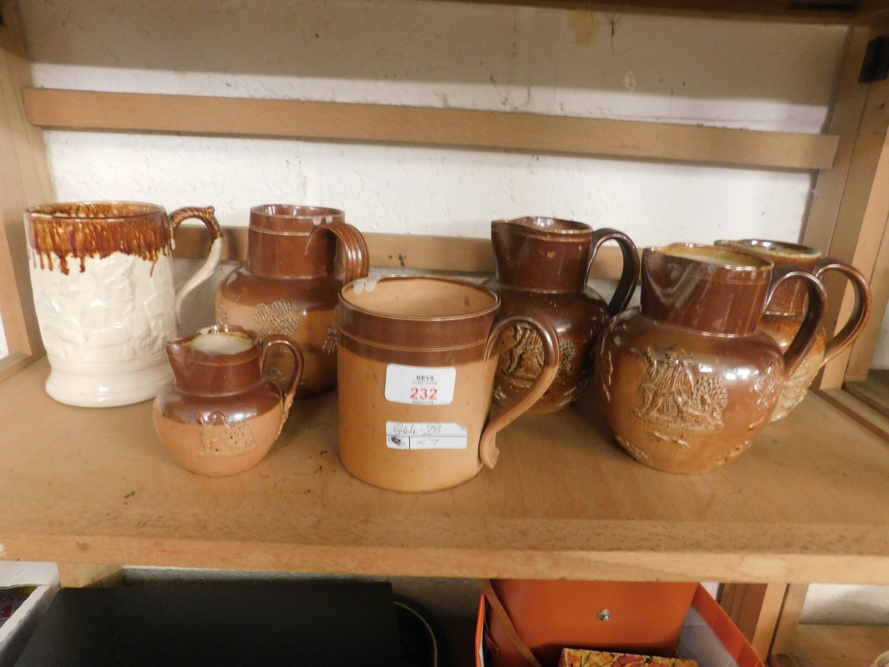 FIVE STONEWARE HARVEST JUGS TOGETHER WITH TWO FURTHER TANKARDS (7)