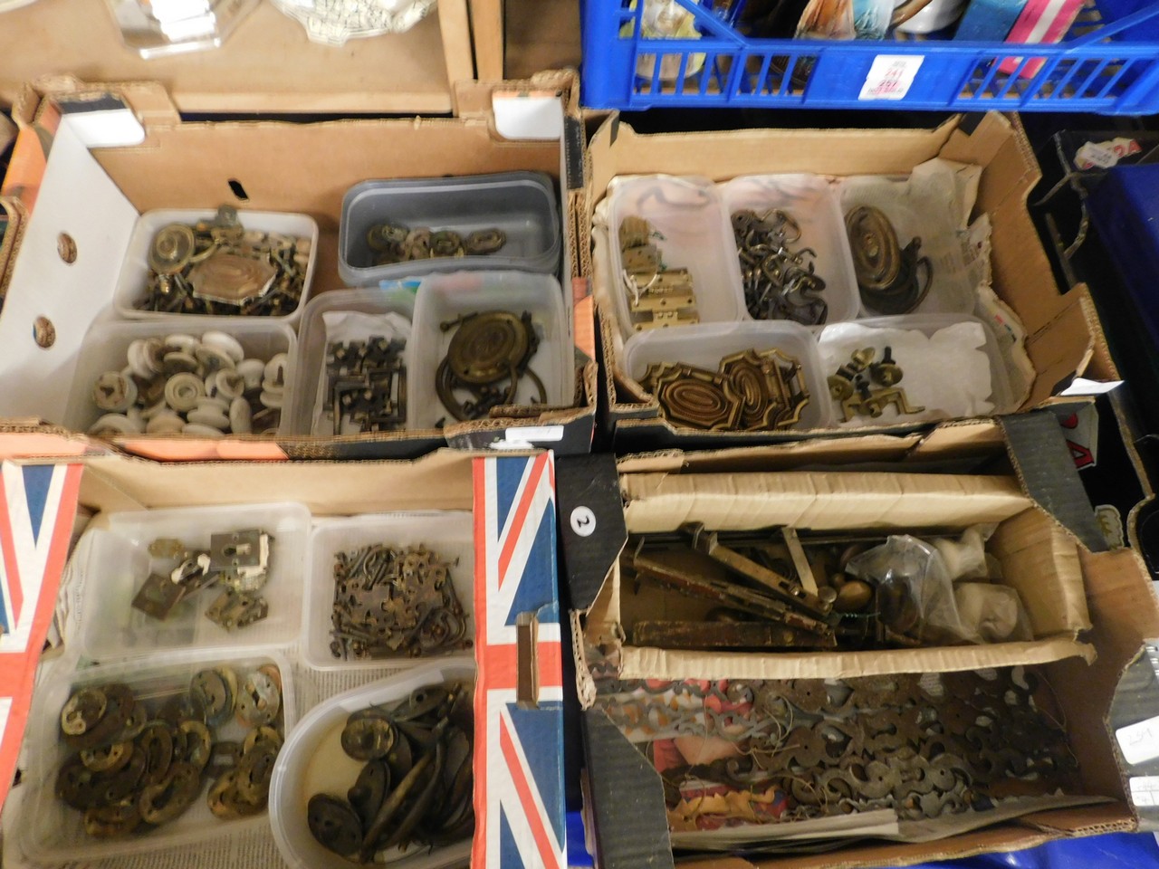 FOUR BOXES OF MIXED FURNITURE FITTINGS, ESCUTCHEONS, DOOR KNOBS, HANDLES, HINGES ETC