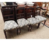 SET OF FOUR AMERICAN WALNUT DINING CHAIRS WITH SPINDLE AND CARVED BACK WITH UPHOLSTERED SEATS AND