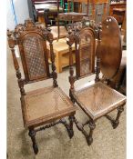 PAIR OF VICTORIAN GOTHIC OAK CARVED HALL CHAIRS WITH CANE SEATS AND BACKS
