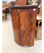 19TH CENTURY MAHOGANY CORNER CUPBOARD OF BOW FRONTED FORM WITH INLAID DETAIL