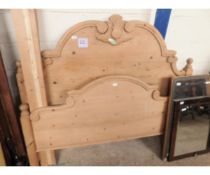 WAXED PINE DOUBLE BED WITH CARVED HEADBOARD AND SIDE RAILS