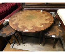 CIRCULAR POKER WORK COFFEE TABLE WITH FISH DETAIL ON TAPERING SQUARE LEGS RAISED ON BRASS CASTERS