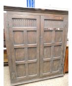 GOOD QUALITY OAK DOUBLE DOOR CUPBOARD WITH PANELLED FRONT AND CARVED DETAIL ON HEAVY CAST HINGES