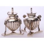 Near pair of late Victorian table lighters of fluted baluster form supported on three rams mask legs