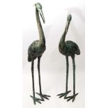 Pair of modern bronze patinated cast metal studies of cranes, 124cm high