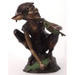 Modern patinated bronze cast metal study of an elf with a fish, 49cm high