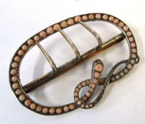 Antique serpent coral set buckle, a design featuring graduated split coral beads set around a coiled