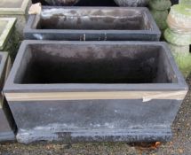 Pair of modern black painted garden planters of rectangular form on stepped bases, 74cm wide