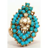 18ct Turquoise and diamond marquise shaped cocktail cluster ring, the centre raised with nine