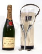 Moet Champagne nv in Moet cool bag with two Moet glasses on Moet stand